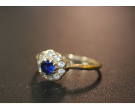 A VINTAGE HALLMARKED 9 CARAT GOLD DRESS RING, set with blue and white stones, approx weight 1.6g, ring size P