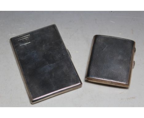 A TALL HALLMARKED SILVER CIGARETTE CASE,  H 12.5 cm together with a shorter curved example, approx combined weight 271g