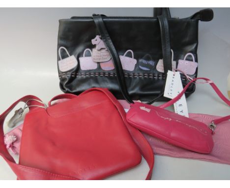 A RADLEY LEATHER CLASSIC CROSS BODY BAG, together with a black 'handbag' design bag, and a small 'everybody loves surprises' 