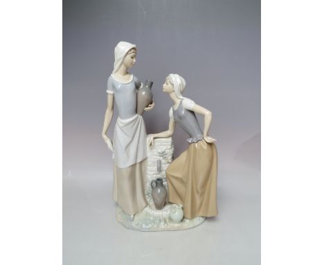 A LARGE NAO FIGURINE OF TWO LADIES COLLECTING WATER, H 39 cm, S/D