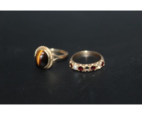 A HALLMARKED 9 CARAT GOLD 'TIGERS EYE' RING, together with a garnet and pearl ring with stones missing, approx combined weigh