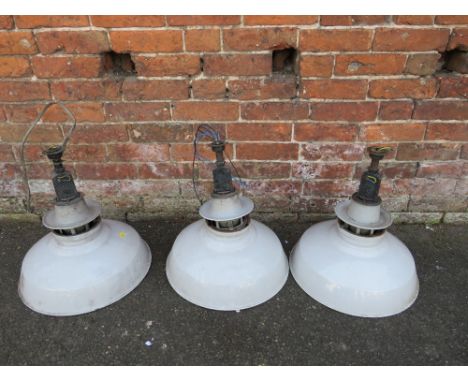 A SET OF THREE VINTAGE INDUSTRIAL HANGING CEILING LIGHTS, with grey enamel shades, overall H 50 cm, shade Dia. 46 cm