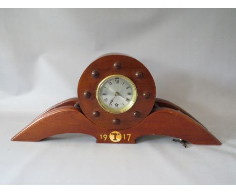 A MANTLE CLOCK MADE FROM THE PROPELLER OF A 1917 AIRCRAFT, in two parts with key, L 69 cm, H 28 cm
