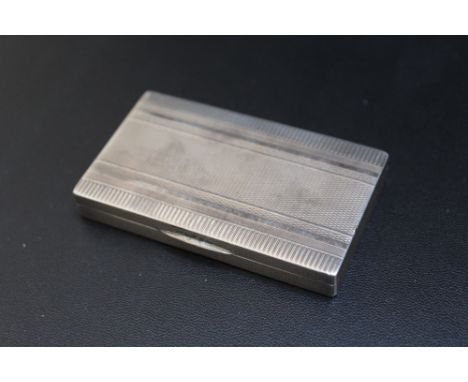 A SLIM CONTINENTAL SILVER SNUFF BOX, stamped 800, approx weight 57.8g, W 7.25 cm