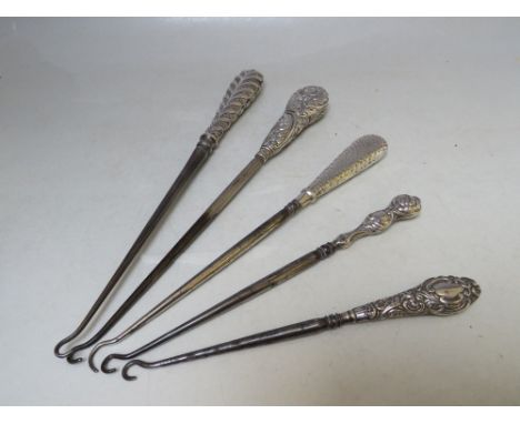 A COLLECTION OF FIVE SILVER HANDLED BUTTON HOOKS, various marks and makers, longest L 29.5 cm