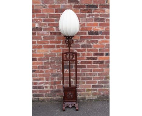 A CHINESE HARDWOOD ADJUSTABLE LAMP STANDARD WITH SHADE, with typical carved and pierced decoration