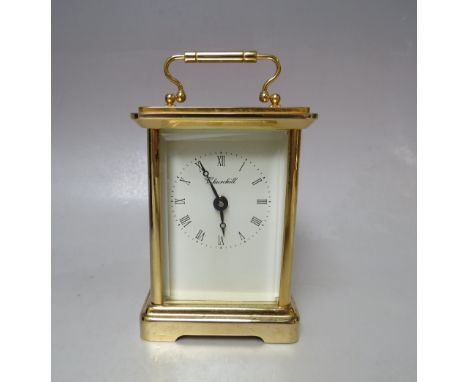 A MODERN LEATHER CASED BRASS 'CHURCHILL' CARRIAGE CLOCK, one glass panel damaged, with key, clock H 14 cm, W 8 cm,, D 7 cm