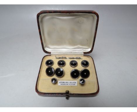 A CASED SET OF VINTAGE STERLING SILVER SHIRT AND COLLAR STUDS, with black enamel and seed pearl embellishment