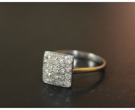 AN 18 CT WHITE GOLD PAVE STYLE DIAMOND CLUSTER RING, having 21 brilliant cut diamonds in a square setting, approx weight 3.8g