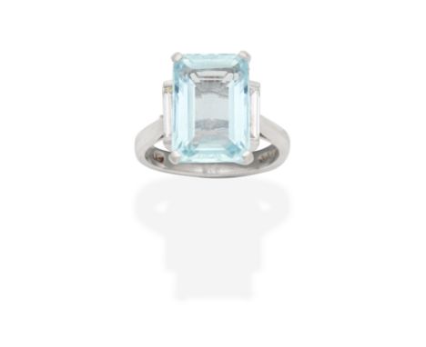 AQUAMARINE AND DIAMOND RING, 2000The step-cut aquamarine between baguette-cut diamonds, mounted in platinum,  diamonds approx