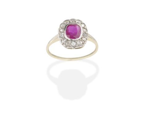 RUBY AND DIAMOND RINGThe cushion-shaped ruby within a rose-cut diamond surround, ruby approx. 0.60cts, ring size approx. M½ F