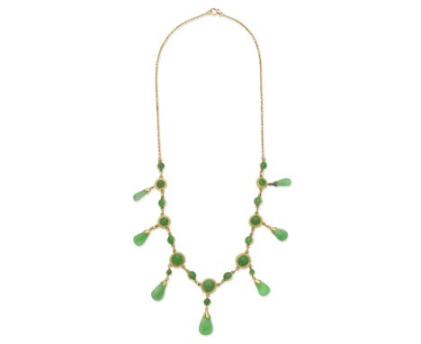 JADE FRINGE NECKLACEThe graduating collet-set jade cabochons, suspending a fringe of seven jade drops, length 46.1cmFor furth
