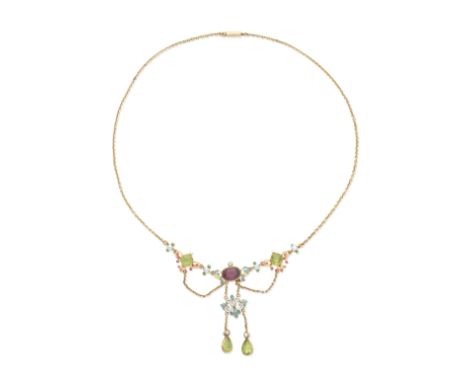 GEM-SET AND ENAMEL NECKLACE, CIRCA 1890-1900The oval-cut purple spinel and octagonal-cut peridot within scrolls decorated wit