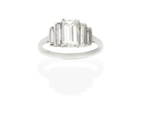 DIAMOND RING, MID 20TH CENTURYThe step-cut diamond, weighing 1.49 carats, between graduating baguette-cut diamond shoulders, 