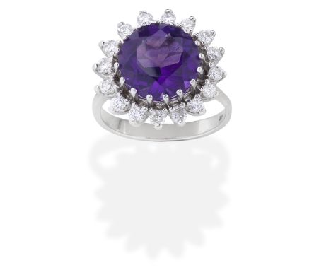 AMETHYST AND DIAMOND RINGThe circular-cut amethyst within a surround of brilliant-cut diamonds,  diamonds approx. 0.45ct tota