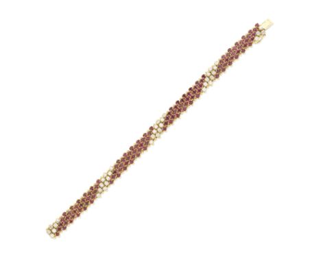 RUBY AND DIAMOND BRACELETThe highly articulated bracelet, set with circular-cut rubies and brilliant-cut diamonds,  diamonds 
