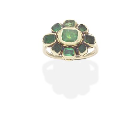 IBERIAN EMERALD AND ENAMEL RING, LATE 17TH - EARLY 18TH CENTURYThe cluster of table-cut emeralds, in closed back settings wit