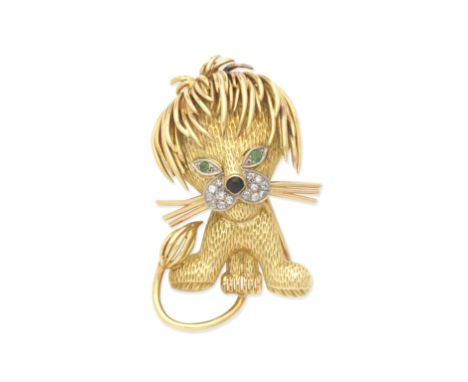 DIAMOND, EMERALD AND ONYX LION BROOCHDesigned as a lion with textured head and body, polished mane, tail and whiskers, the he
