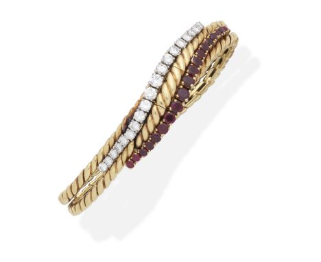 BOUCHERON: RUBY AND DIAMOND BRACELET/WATCH, CIRCA 1950Of undulating design, set with a graduating row of brilliant-cut diamon