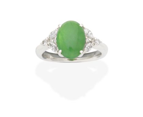 JADE AND DIAMOND RINGThe oval jadeite jade cabochon between brilliant and marquise-cut diamond shoulders, ring size approx. L