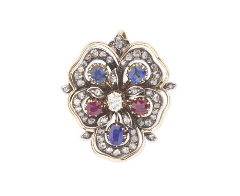 RUBY, SAPPHIRE AND DIAMOND PANSY BROOCH/PENDANT, CIRCA 1890The openwork pansy, set with cushion-shaped rubies and sapphires, 