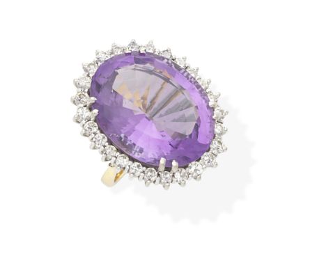 AMETHYST AND DIAMOND DRESS RINGThe oval-cut amethyst within a brilliant-cut diamond surround, diamonds approx. 1.35cts total,