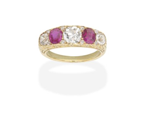 RUBY AND DIAMOND RINGSet with alternating old brilliant-cut diamonds and cushion-shaped rubies with similarly-shaped diamond 