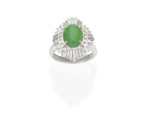 JADE AND DIAMOND RINGThe oval jadeite jade double cabochon within an undulating brilliant and tapering-baguette cut diamond s