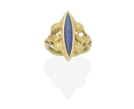 ART NOUVEAU OPAL RING, CIRCA 1900The marquise-shaped opal cabochon, between shoulders of brushed thistle design,  maker's mar