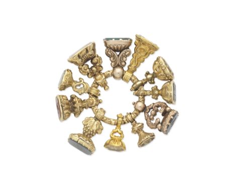 COLLECTION OF FOB SEALS, 19TH CENTURYThe engraved hoop suspending eleven fob seals; 1st: The carnelian depicting a dove in fl