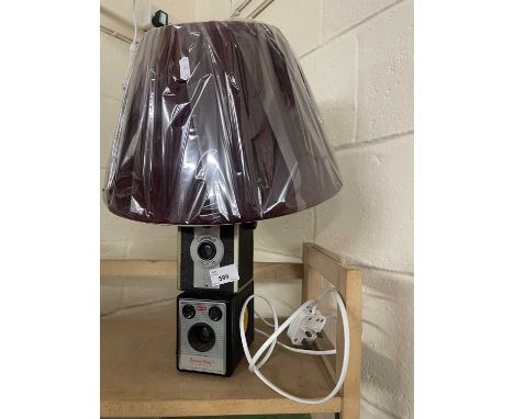 Upcycled table lamp formed from two vintage cameras