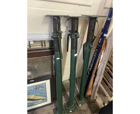 Three metal acrow props
