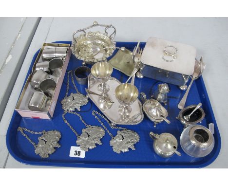A Hallmarked Silver Topped Glass Match Strike, a set of four pewter decanter labels, hotel ware small milk/cream jugs, plated