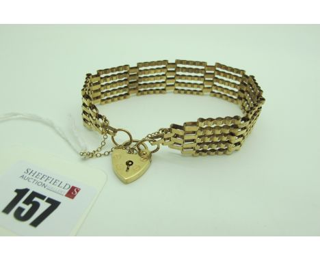 A 9ct Gold Gate Link Style Bracelet, to 9ct gold heart shape padlock style clasp (9.5grams). 