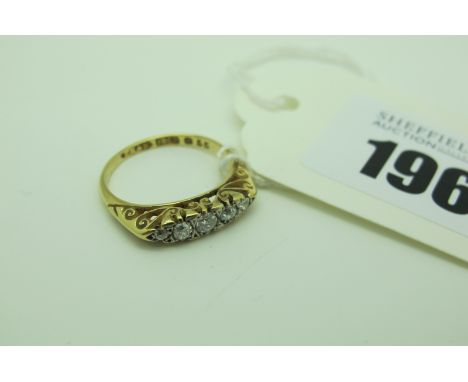 An Antique Five Stone Diamond Ring, set with old cut stones, within scroll carved setting, stamped "18ct" (finger size L1/2) 