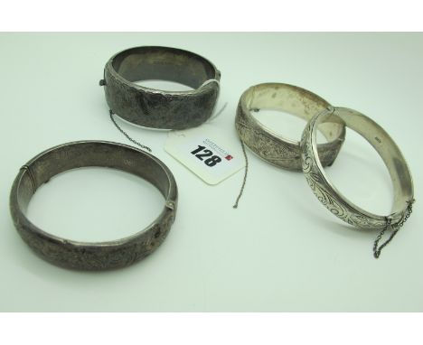 A Wide Hallmarked Silver Hinged Bangle, foliate engraved to the front (dents); Together with Three Further Hallmarked Silver 