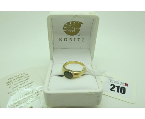 Korite; A Modern Canadian Ammolite Single Stone Ring, oval collet set, stamped "14K" (finger size T1/2) (3.7grams), in origin