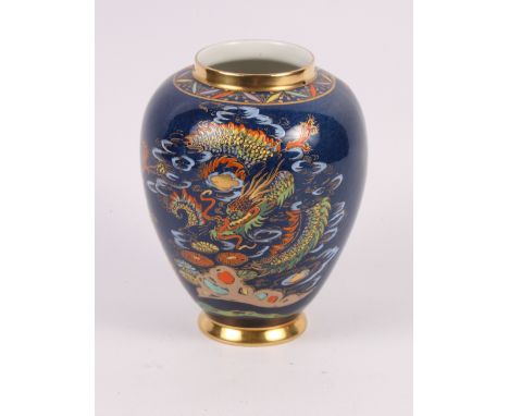 A Carlton oviform vase decorated oriental landscapes on a blue ground, 12" high, and six similar Carlton vases and dishes
