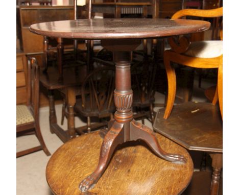 An 18th Century circular mahogany tilt top occasional table, on vase turned pillar and carved tripod base, 30" dia