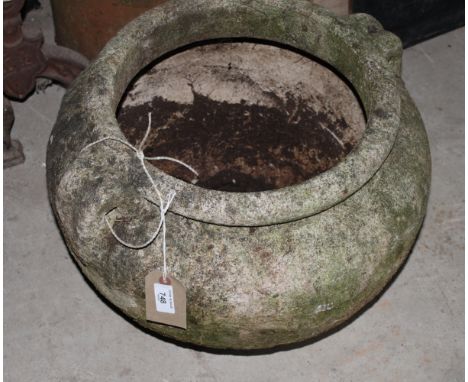 A weathered cast two-handled garden planter