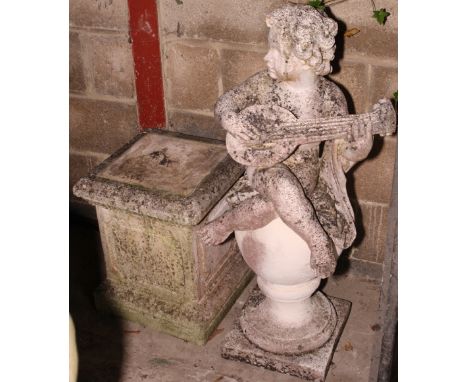 A seated cherub playing a lute on square base