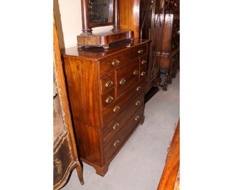 A 19th Century design mahogany two-section military chest, fitted eight drawers and deep central secretaire drawer with oval 