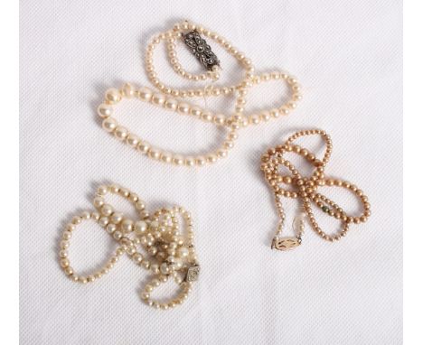 Three graduated pearl necklaces, one with 9ct gold clasp