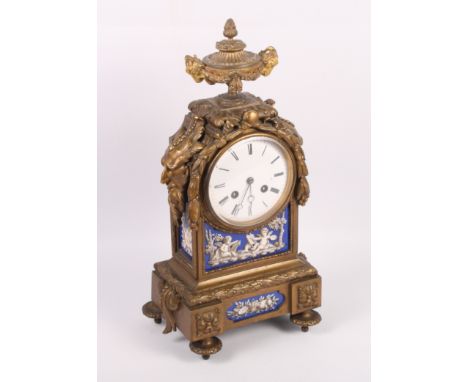 A 19th Century French gilt brass and porcelain panelled mantel clock, eight-day striking movement, enamelled dial (star crack