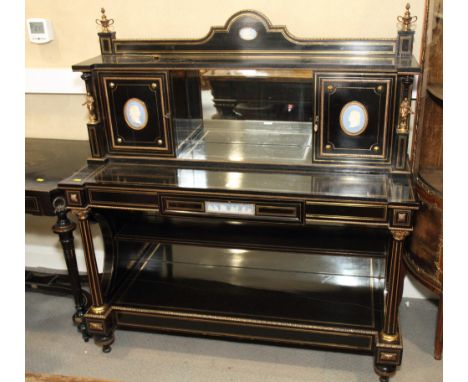 A late 19th Century ebonised side cabinet, back fitted centre mirror flanked by two cupboards enclosed doors inset jasperware