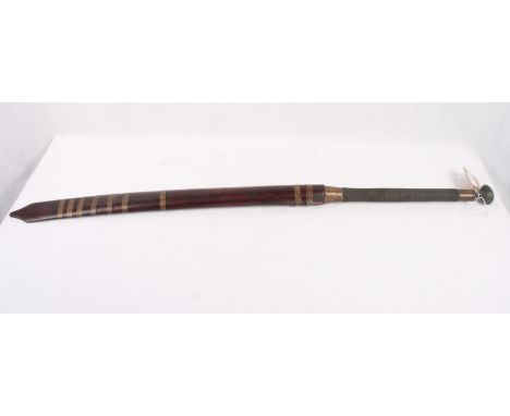 A Thai or Burmese dha sword, engraved blade 22 1/2" long, brass bound hardwood scabbard and wire bound grip