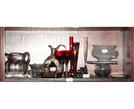 A Wedgwood ruby and glass clear paperweight, glass jugs, a mirrored wall sconce and other items of glass ware, and a collecti