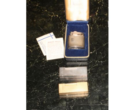 A silver plated Dunhill cigarette lighter, a gold plated Dunhill lighter and a Ronson lighter, in case