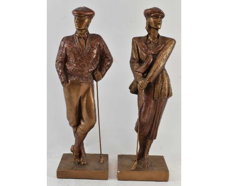 AUSTIN; a pair of bronzed and coppered ceramic models of golfers, height of tallest 41cm.