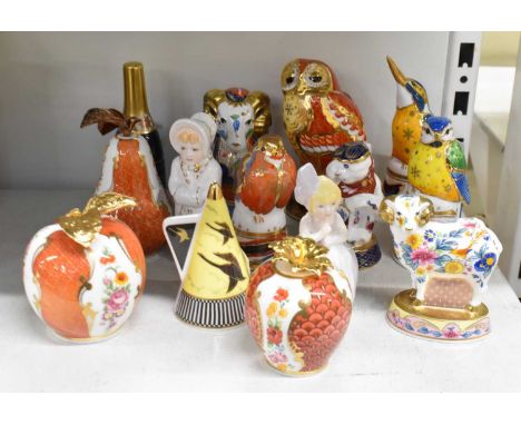 ROYAL WORCESTER; a collection of fourteen assorted candle snuffers.